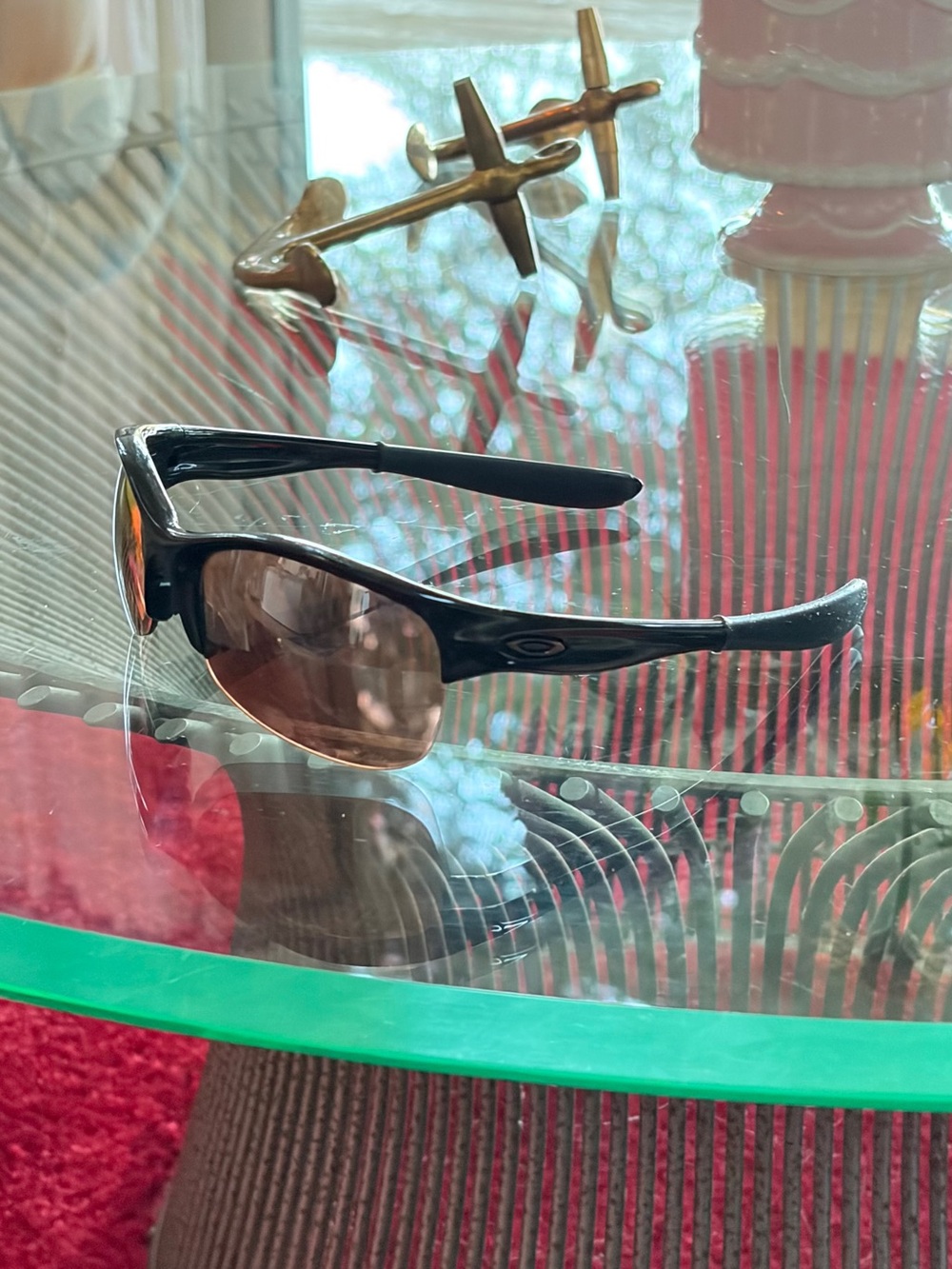 Oakley Black Frame Sunglasses with Brown Tinted Lenses
